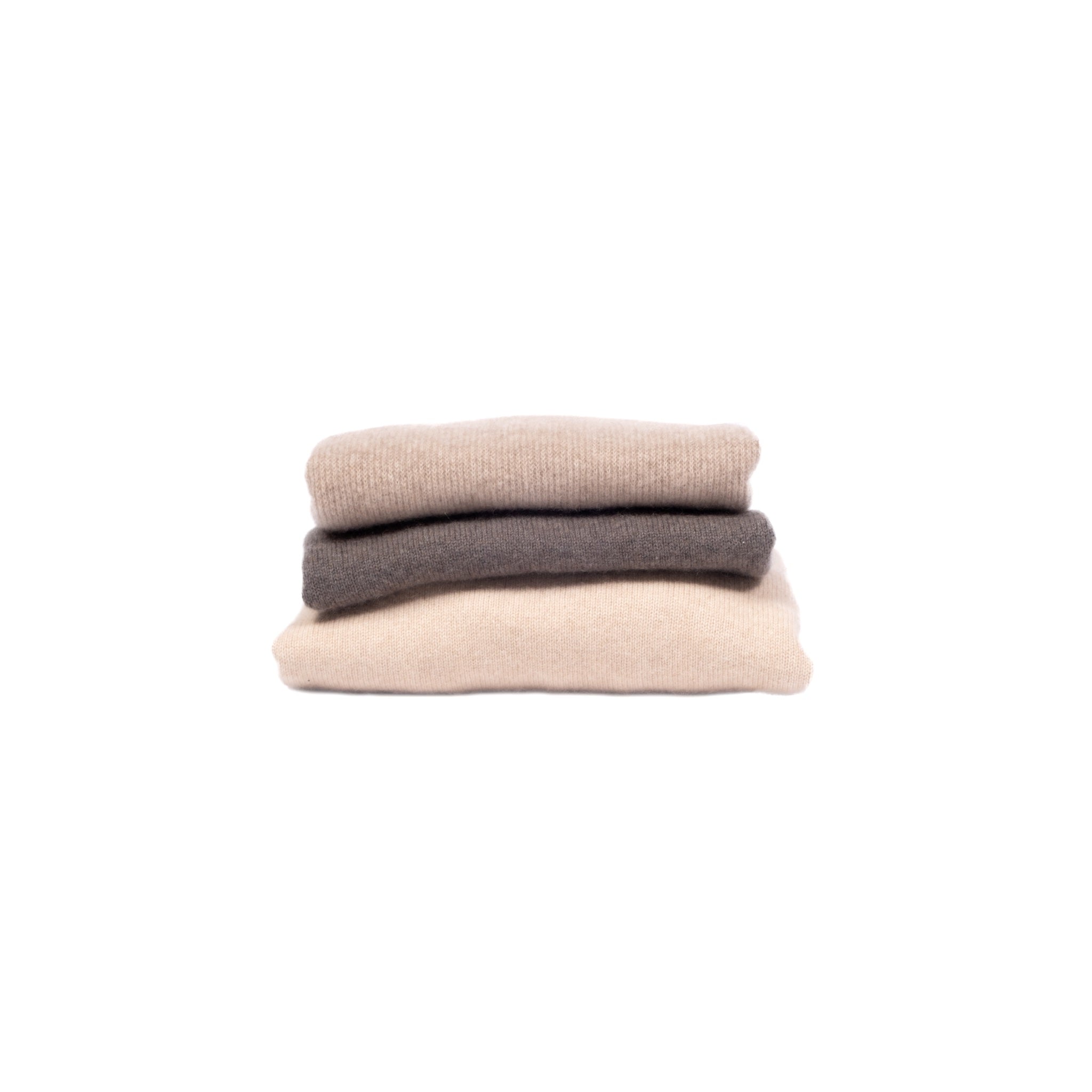 The Wanli Sweater in three colors, folded