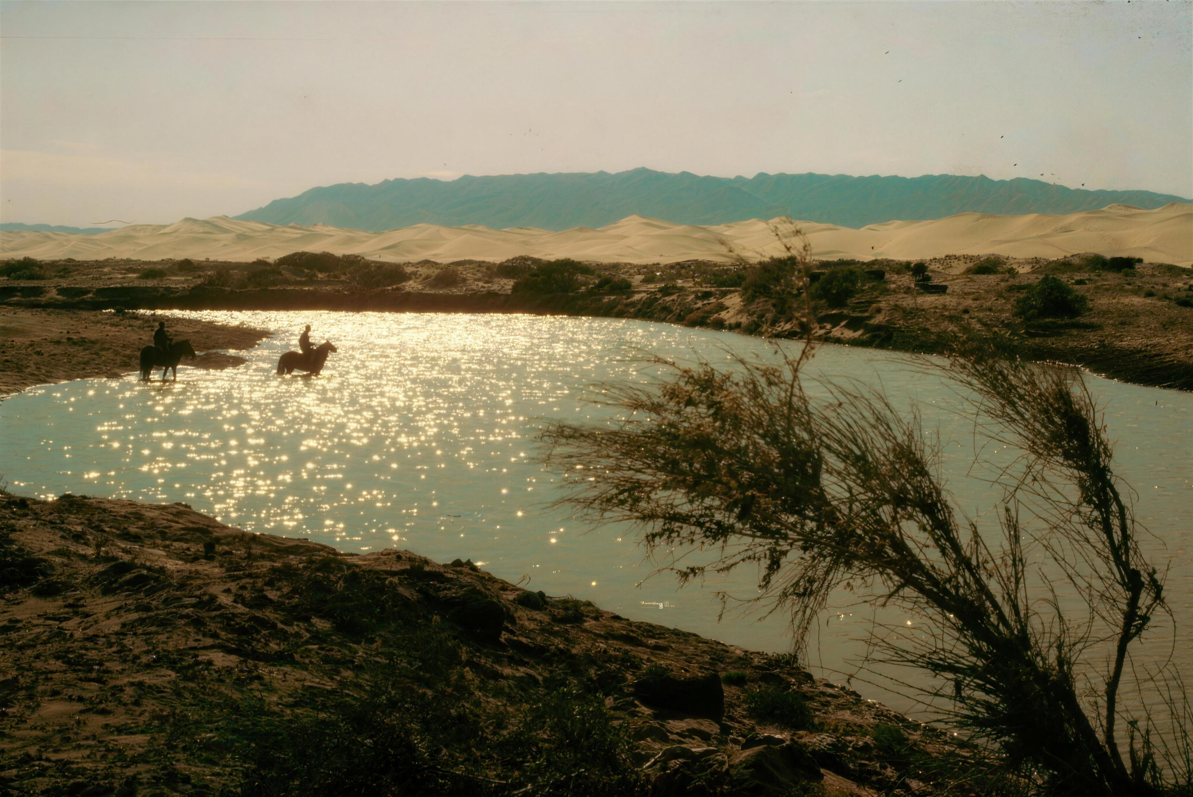 Riders crossing a Gobi river, from the WANLI archive